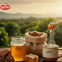 Agriko honey being drizzled into a cup with a scenic background